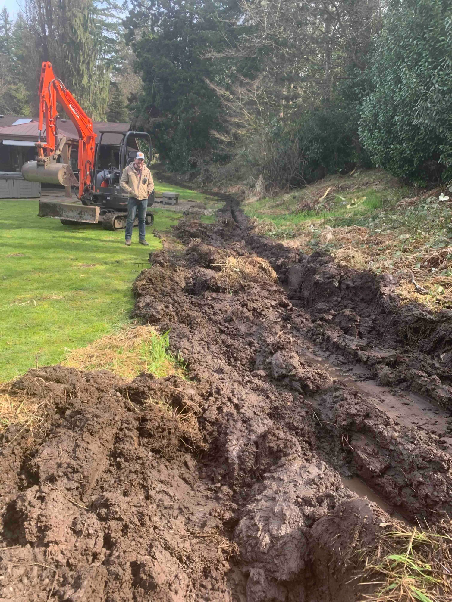 Joel surveying a trench