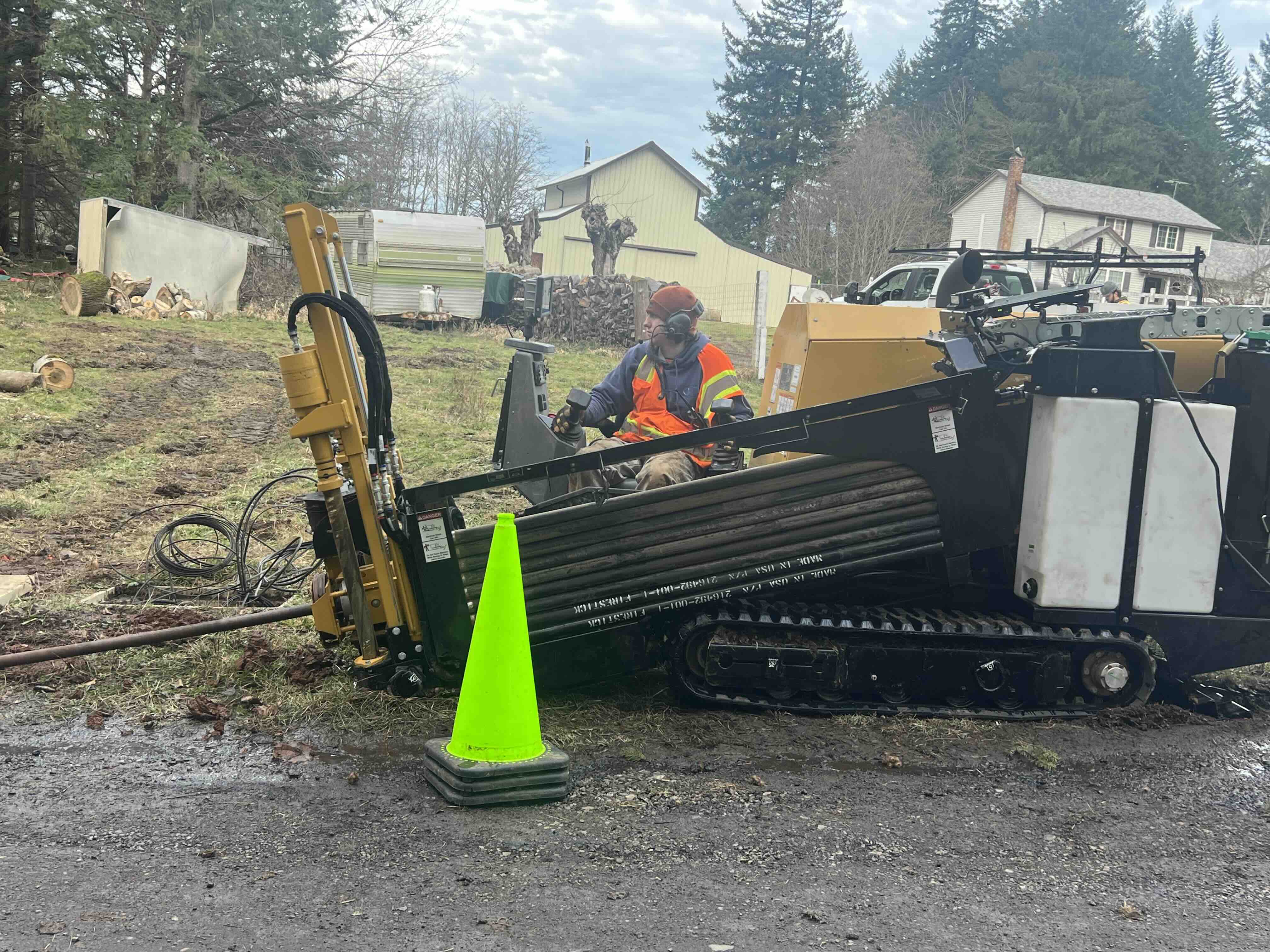 Boring machine drilling new conduit